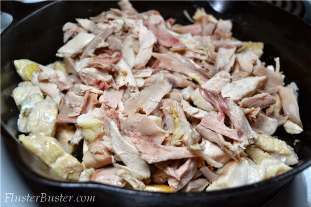 Simple Chicken Enchilada Casserole -  seasoned chicken, layered between corn tortillas and cheese and then covered a flavorful sauce.