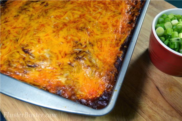 Simple Chicken Enchilada Casserole -  seasoned chicken, layered between corn tortillas and cheese and then covered a flavorful sauce.