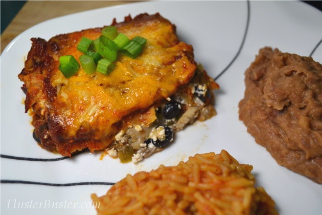 Simple Chicken Enchilada Casserole -  seasoned chicken, layered between corn tortillas and cheese and then covered a flavorful sauce.