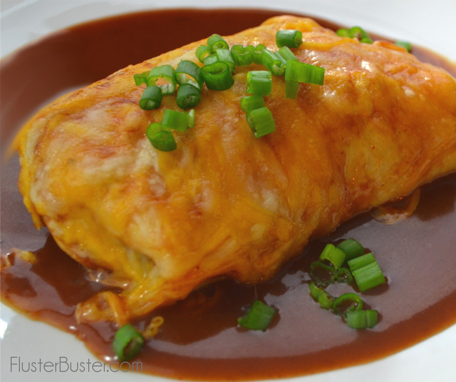 Seasoned ground beef and beans wrapped in a flour tortilla, then it's topped with a very mild and flavorful sauce and lots of cheese. This is a great alternative for those that don't like the strong flavor of enchilada sauce. Simple, delicious recipe.