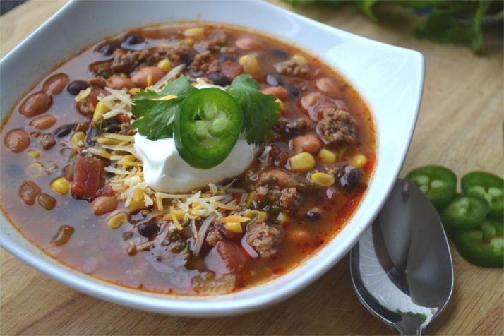 This is how I beat the cold, with a nice warm bowl of Mexican Chili served with a handful of corn chips. It's simple, delcious and it will warm you from your head to your toes.