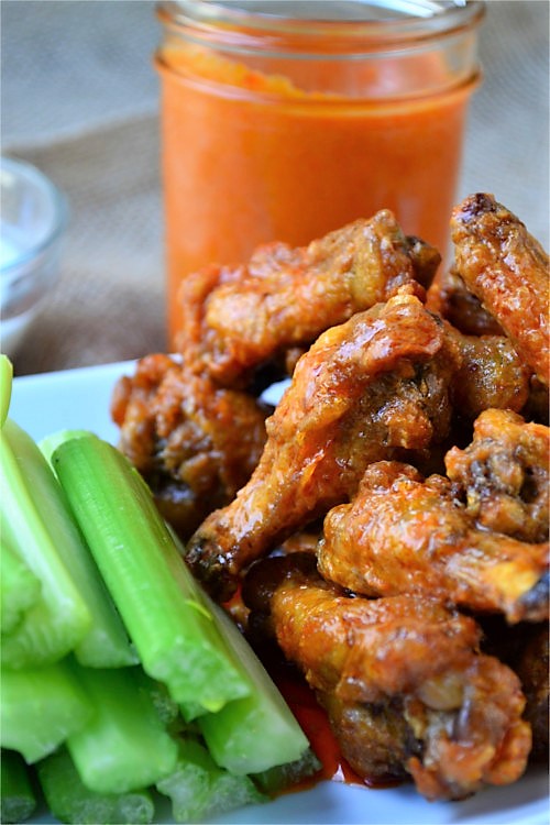 Simple Buffalo Sauce - A simple sauce that is slightly spicy, with a little heat and a nice buttery texture. This buffalo sauce is a milder and more sumptuous form of hot sauce and tastes amazing smothered over chicken wings or used to replace traditional hot sauce.